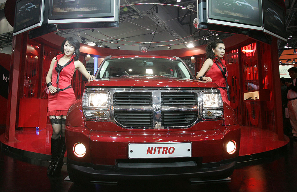 A Model poses next to a Dodge Nitro at the Seoul Motor Show 2007
