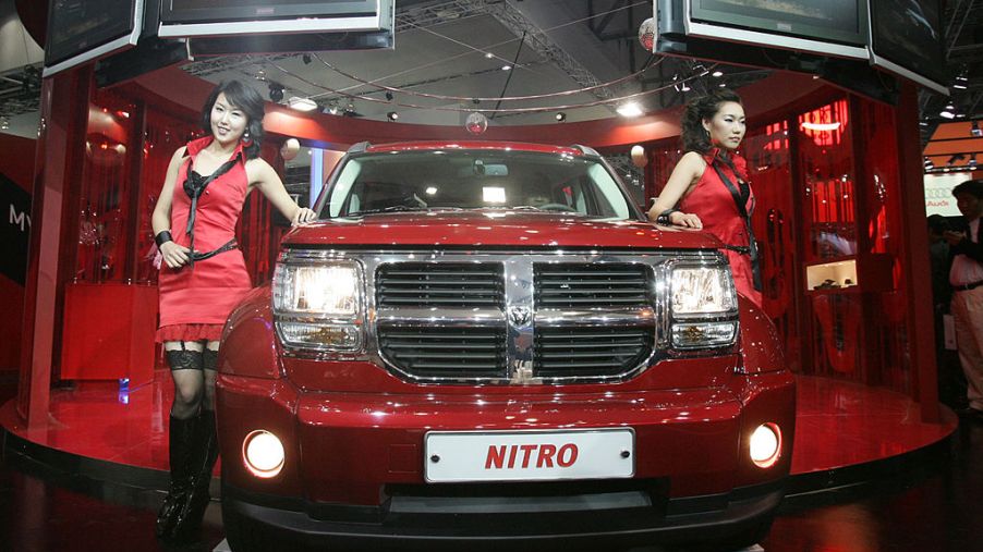 A Model poses next to a Dodge Nitro at the Seoul Motor Show 2007