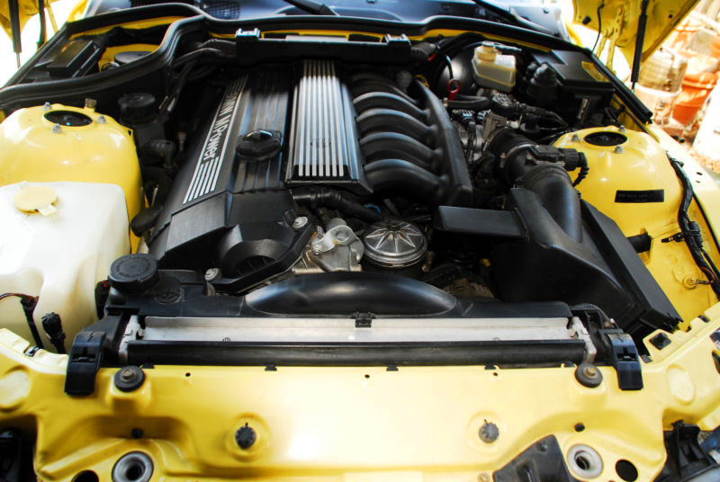 A close-up of the engine in a 2000 BMW Z3 M Roadster.
