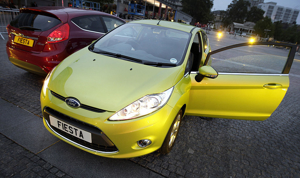 A lime green Ford Fiesta