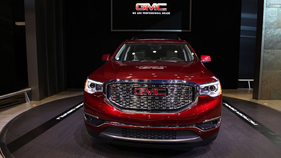 A red GMC Acadia on display