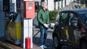 A man with mask makes gasoline from a gas station in Turin during on the Italy Extends Coronavirus Lockdown
