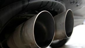 A close-up of the dual exhaust pipes on a performance car.