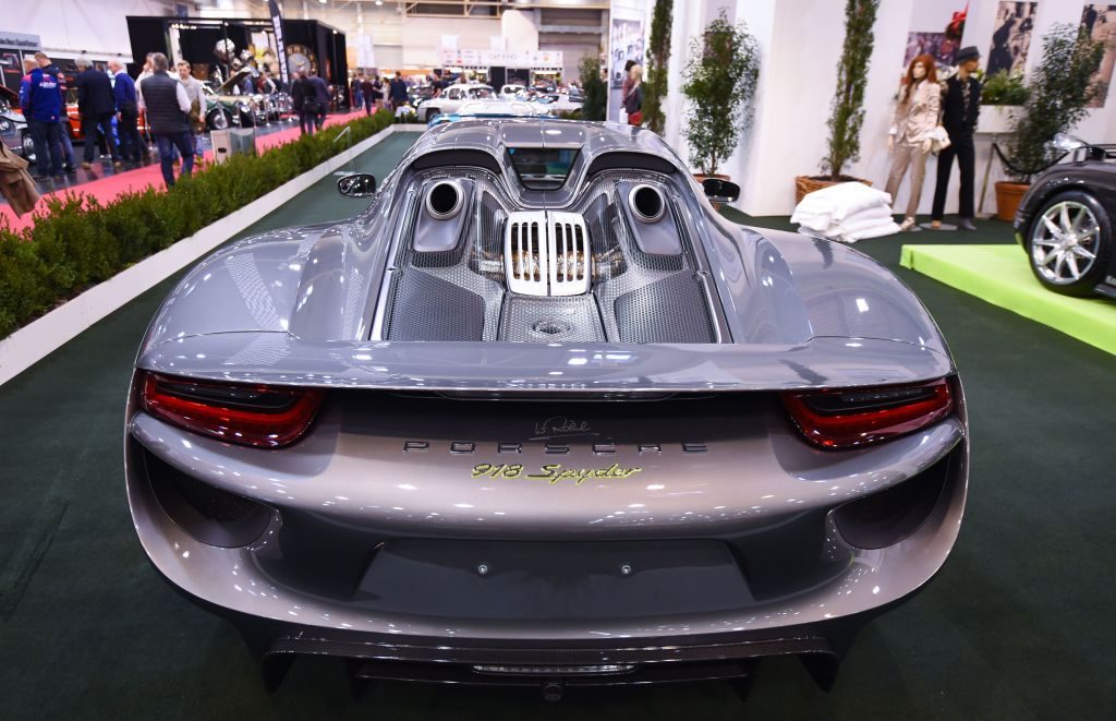 The rear of a silver 2015 Porsche 918 Spyder.