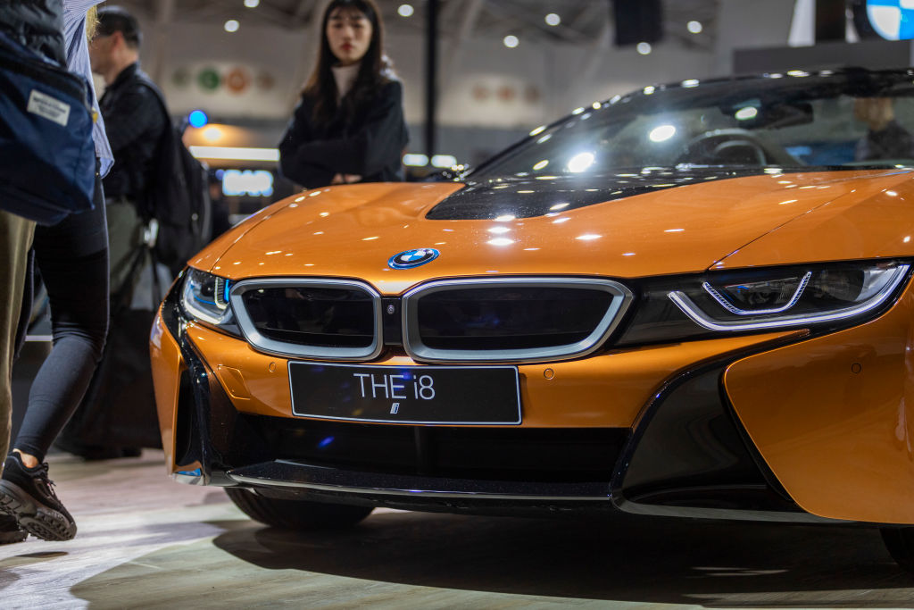 The front end of an orange 2020 BMW i8 hybrid supercar.