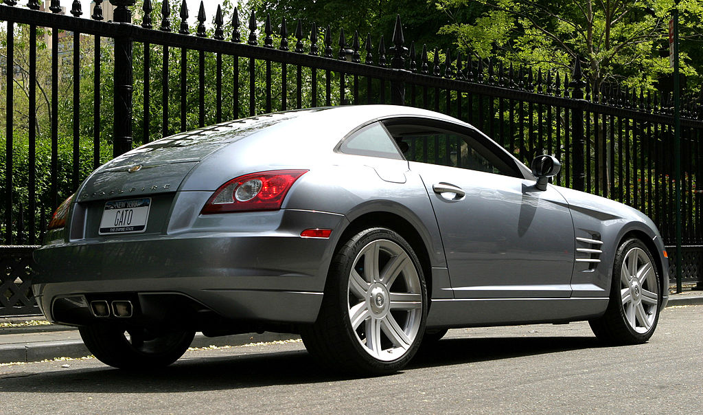 The rear three-quarters view of a silver 2003 Chrysler Crossfire.