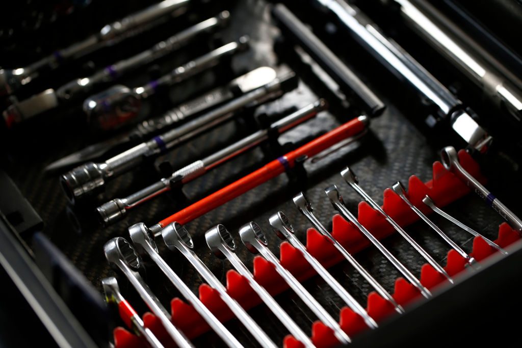 A roadside emergency tool kit with lots of wrenches, screwdrivers, and sockets.