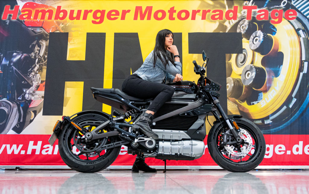 A model poses on a Harley-Davidson electric motorcycle during a press conference for the Hamburg Motorcycle Days