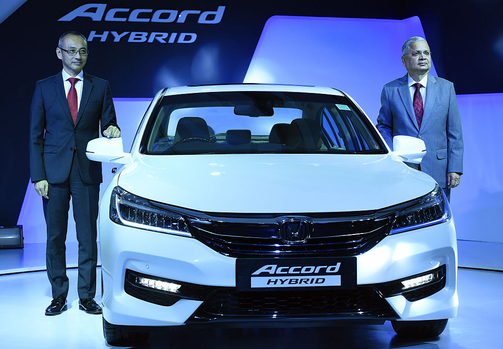Yoichiro Ueno, President and CEO of Honda Cars India Ltd., and Raman Sharma, Director of Corp. Affairs Honda Cars India Ltd., during the launch of the all new Honda Accord Hybrid Feather Car