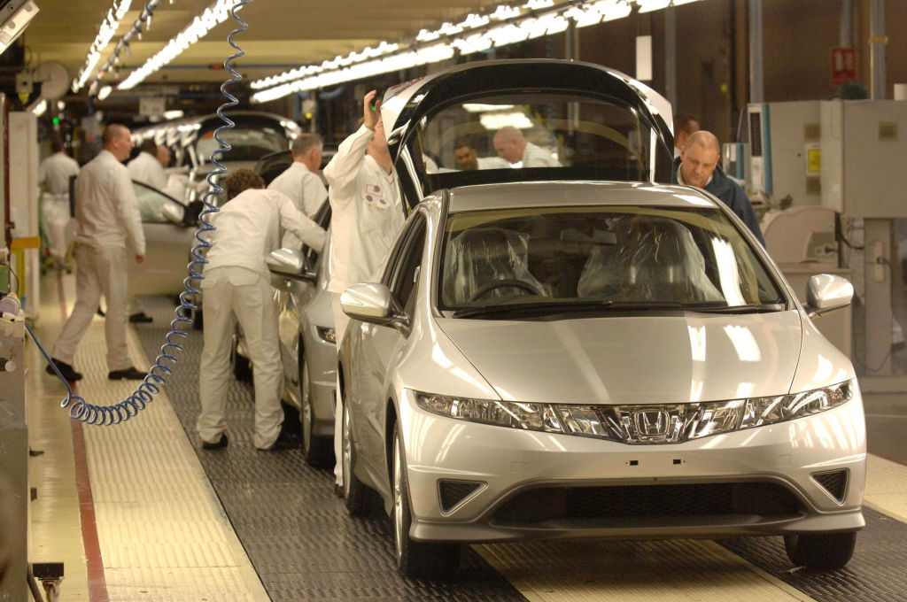 A Honda Civic being assembled at a factory