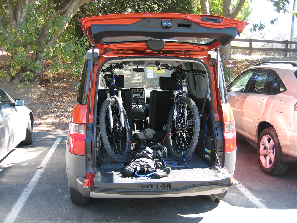 Honda Element cargo area with two bikes fit neatly inside shows another good used SUV under $5,000 according to KBB