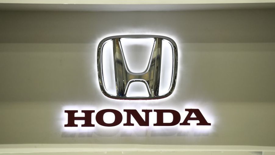 A Honda logo on a wall