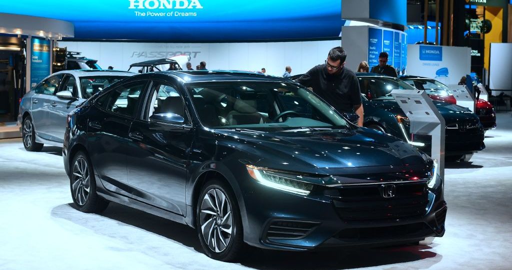 A man views the Honda Insight, named Green Car of the Year, on display in Los Angeles, California