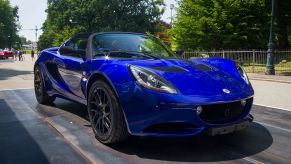 A bright blue Lotus Elise parked at the Parco Valentino car show