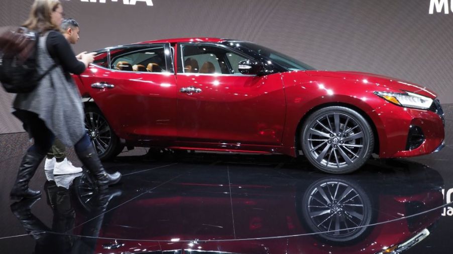 Attendees rush up to get a look at the 2019 Nissan Maxima at AutoMobility LA, the trade show ahead of the LA Auto Show