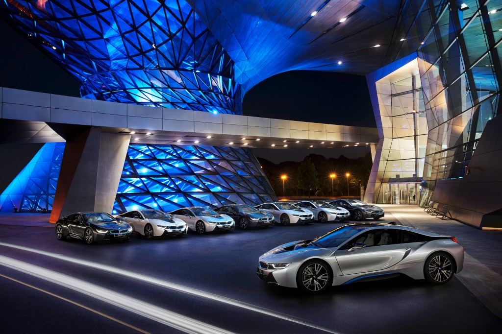 A collection of 2015 BMW i8 supercars parked outside of the BMW Welt in Munich, Germany.