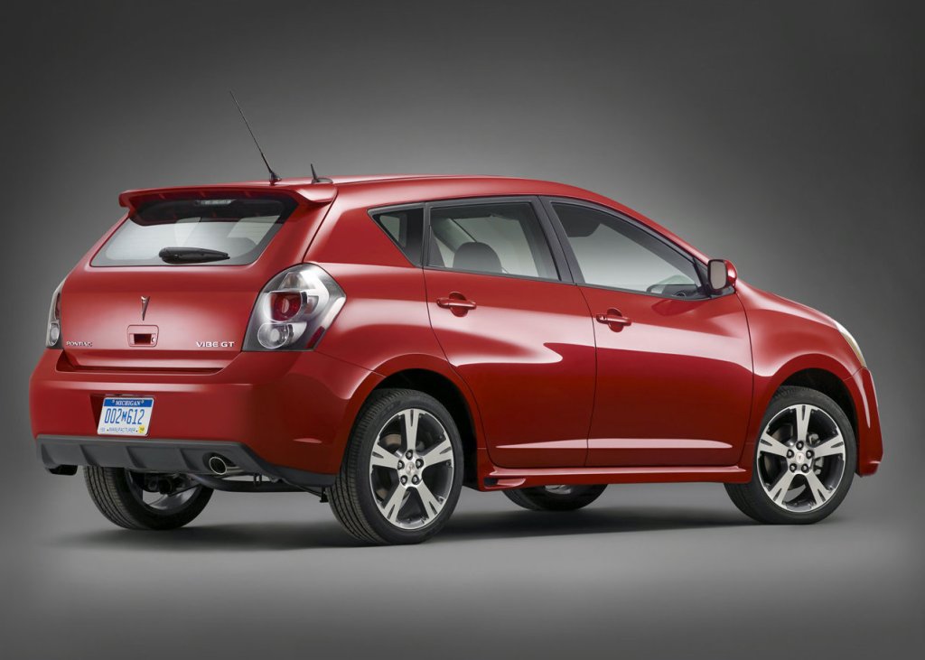press photo of a red Pontiac vibe against a gray backdrop is one of consumer reports best used cars and SUVs under $10,000