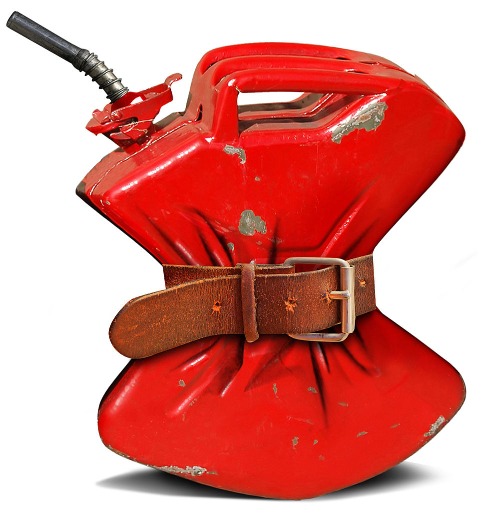 A red gas can with a belt strapped around the middle