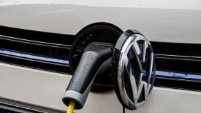 An electric Volkswagen car at a charging port