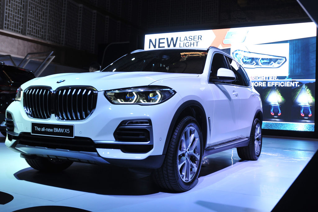 A BMW X5 on display at an auto show