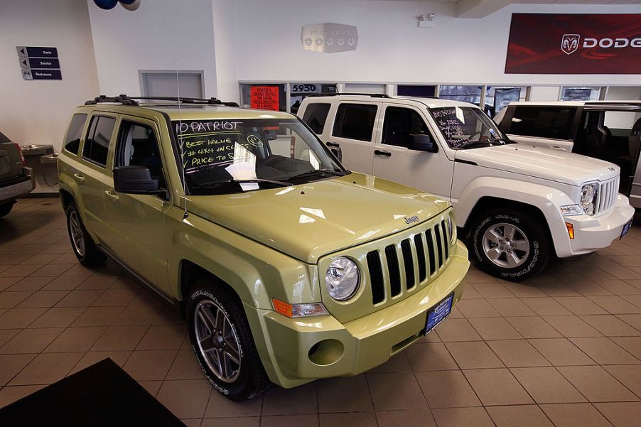 A 2010 Jeep Commander inside of a car dealership