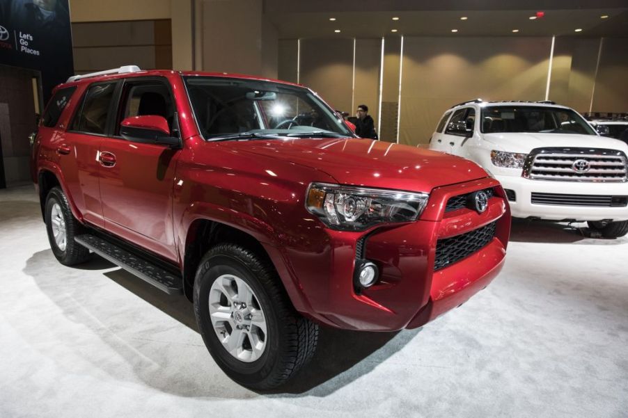 A red 2017 Toyota 4Runner on display at an auto show