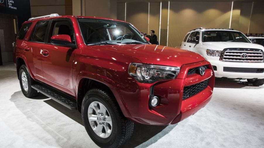 A red 2017 Toyota 4Runner on display at an auto show