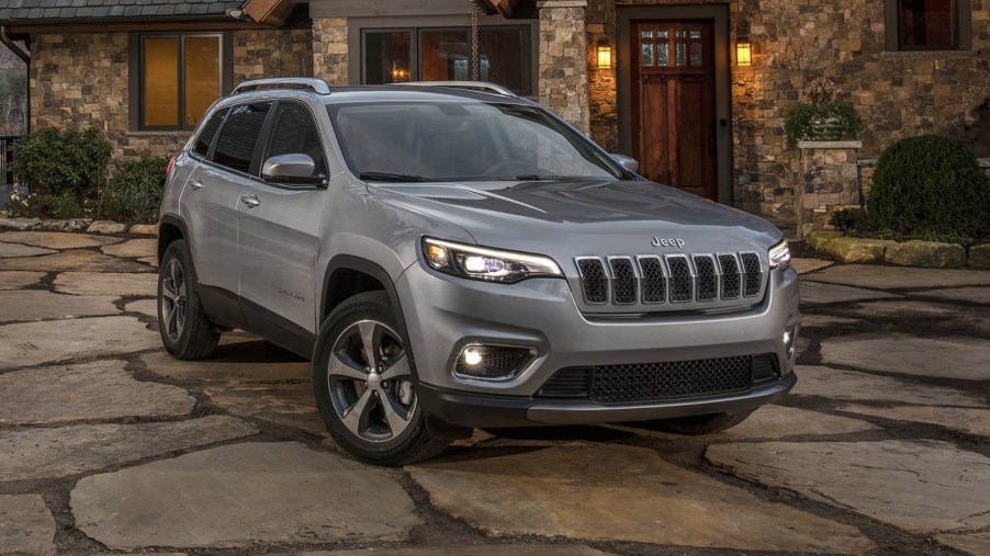 The 2019 Jeep Cherokee parked near a building
