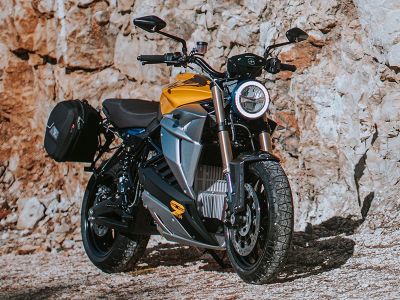 2020 Energica Eva EsseEsse9+, an automatic motorcycle against a rock background.