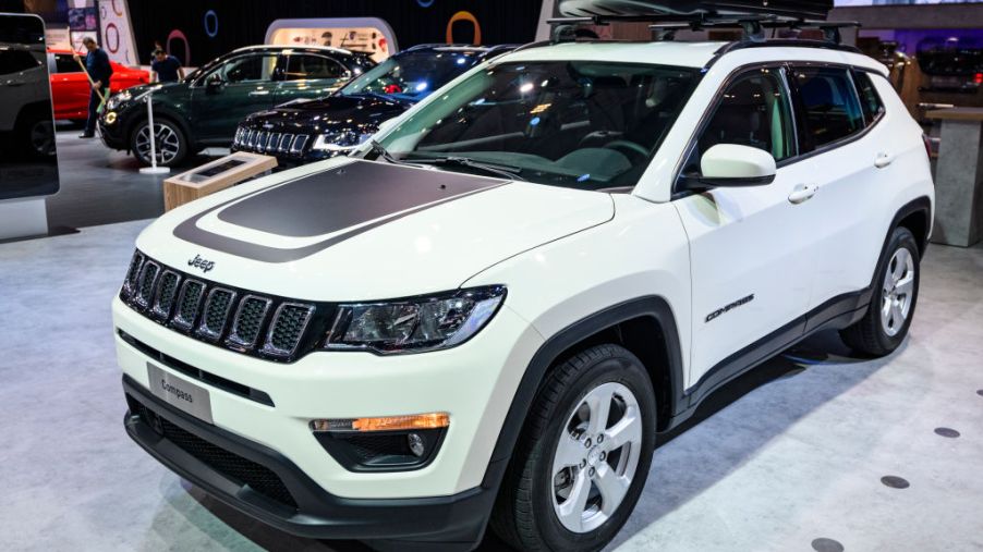 A 2020 Jeep Compass on display at an auto show