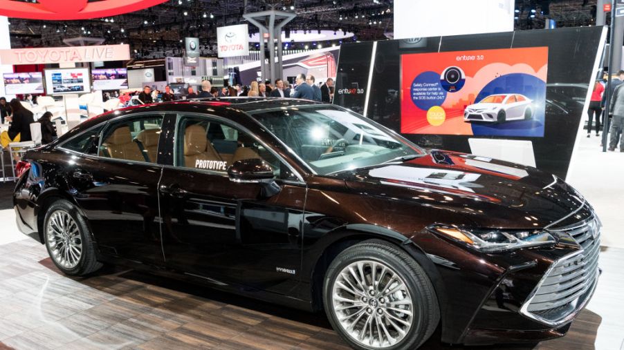 A black Toyota Avalon on display at an auto show