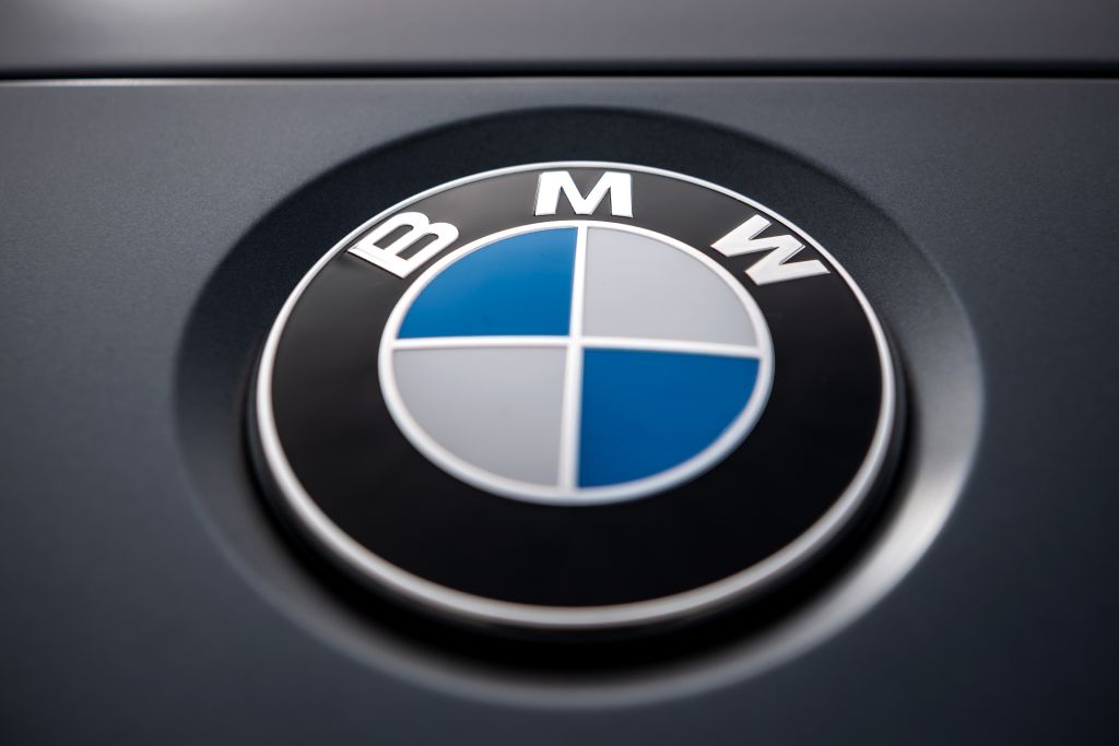 The logo of the Munich car manufacturer BMW can be seen on a car