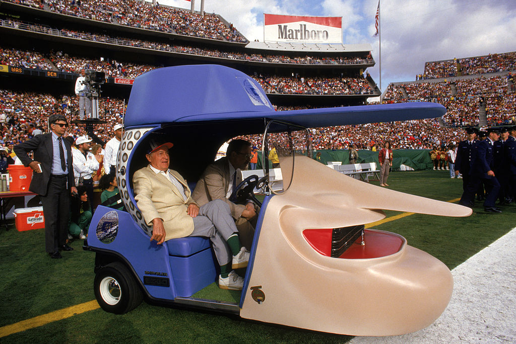 Bob Hope sitting in his George Barris designed golf cart