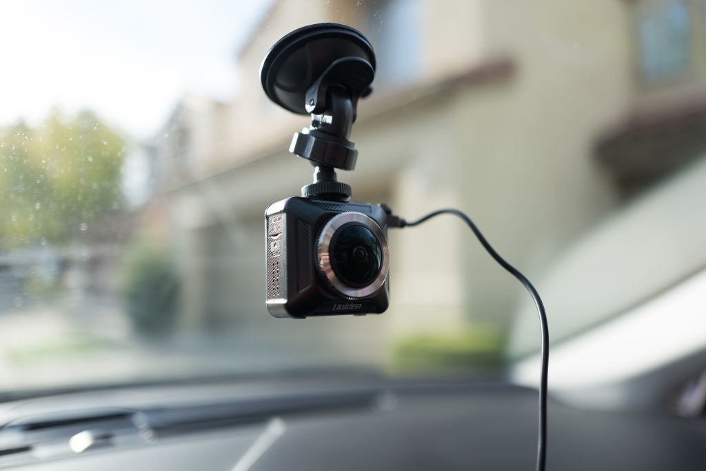A dashcam installed on an Uber driver's windshield