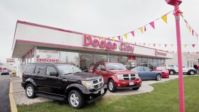 Dodge vehicles on display at a car dealership