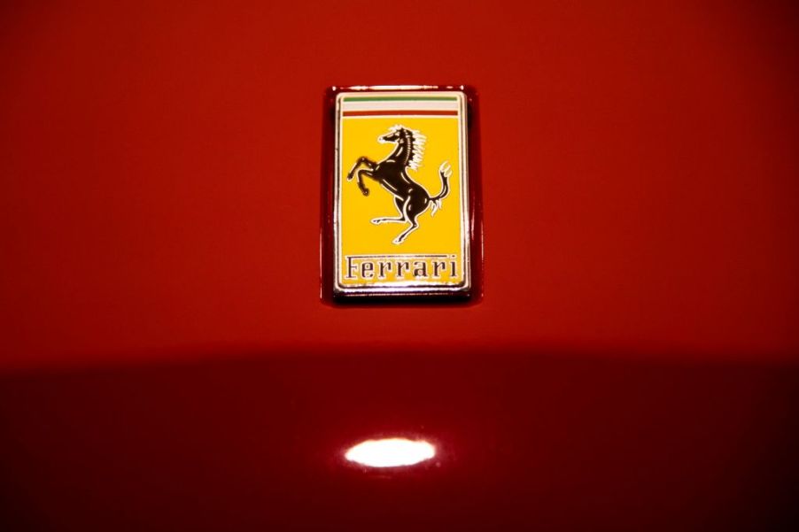 A Ferrari logo on the hood of a car