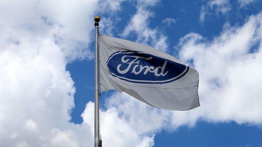 A Ford flag flies outside the Ford Motor Company Conference and Event Center