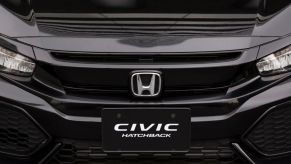 A Honda Motor Co. Civic Hatchback vehicle is displayed outside the company's headquarters