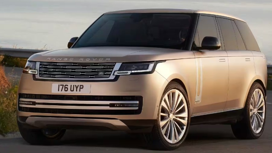 A gold Land Rover Range Rover full-size luxury SUV.