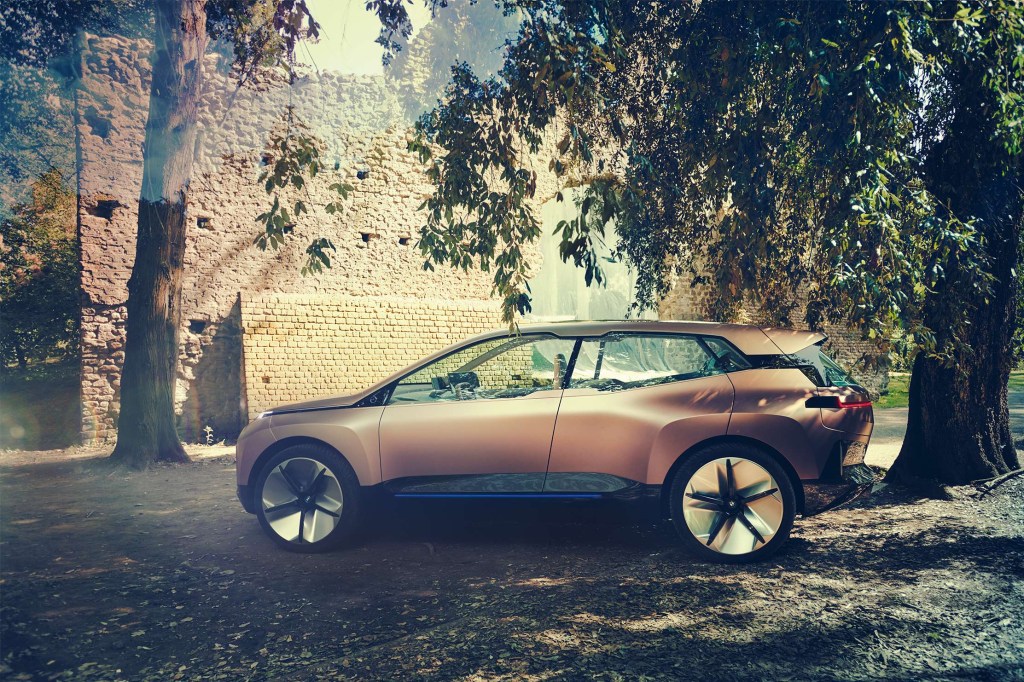 The sleek and understated iNext crossover parked under a low-hanging tree.