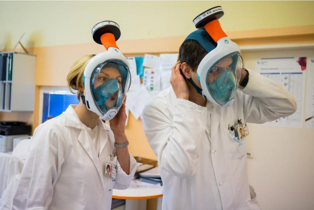 Medical workers wearing transformed snorkel masks