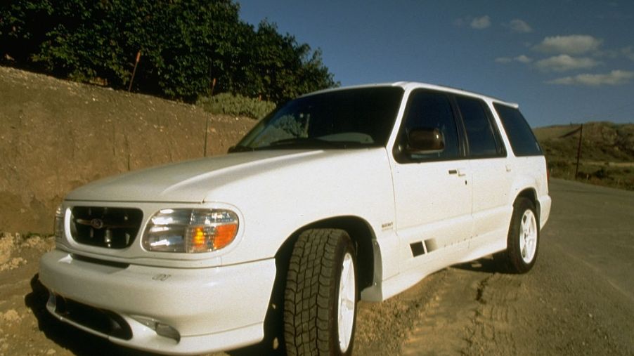 A white Saleen XP8 Ford Explorer parked on a dirt road