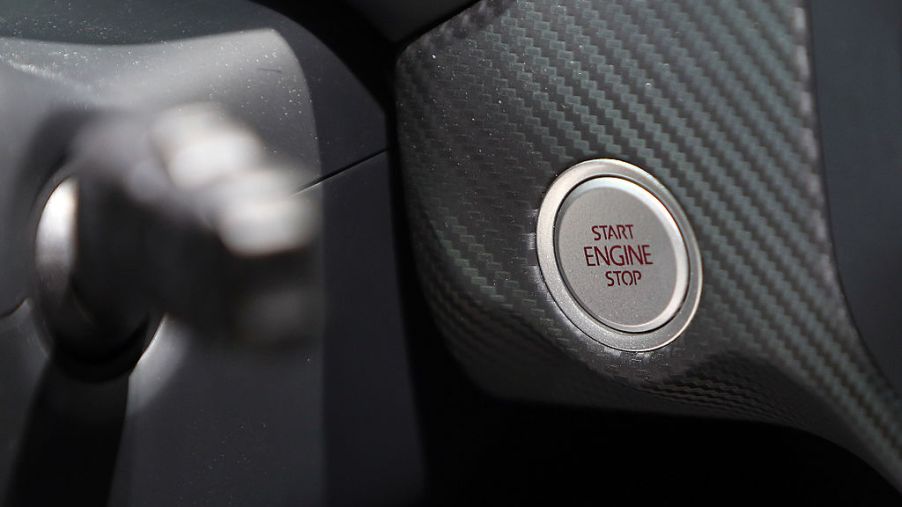 The engine ignition start/stop button of a Volkswagen XL1 plug-in diesel-electric hybrid automobile
