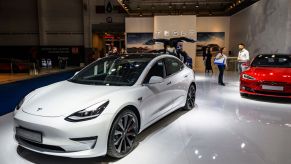Tesla Model 3 compact sedan car in white on display at Brussels Expo