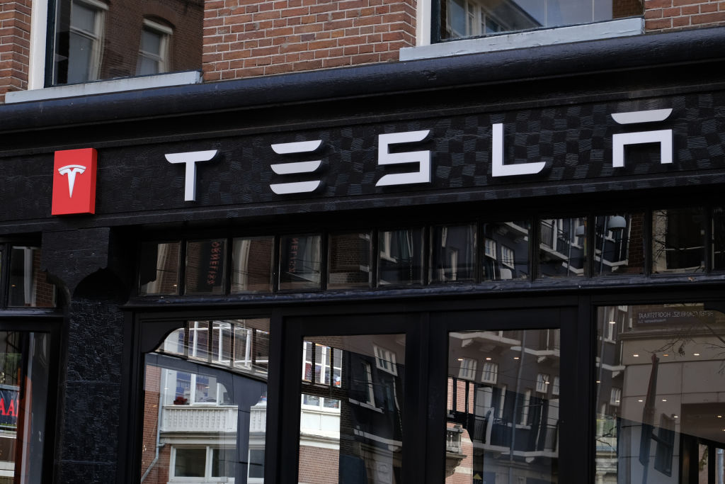 A logo of Tesla is seen outside its showroom on March 14, 2020 in Amsterdam, Netherlands