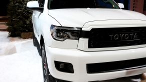 A white Toyota Sequoia on display at an auto show