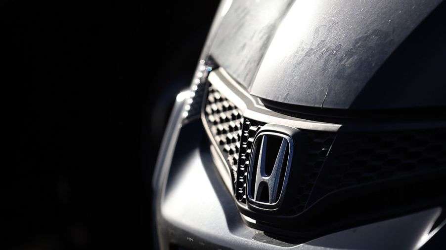A Honda logo seen on the front of an SUV