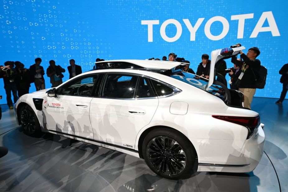 People check out a Toyota car on display