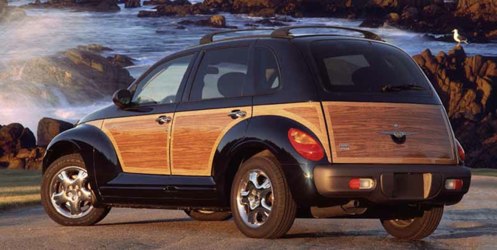 A PT Cruiser with a woody package sits by the water