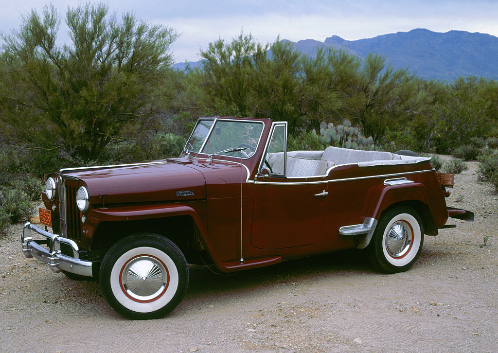 1948 Willys Jeepster parked at the beach 